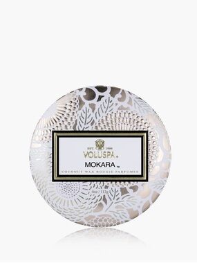 Voluspa Mokara candle with Decorative Tin.12 oz. Never used.Some dust on candle